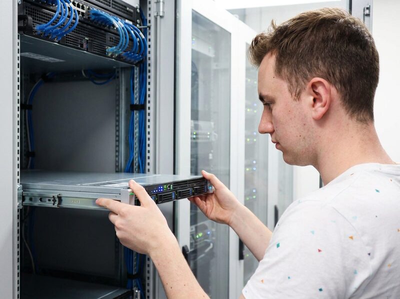 Lars installing a server in a datacenter rack